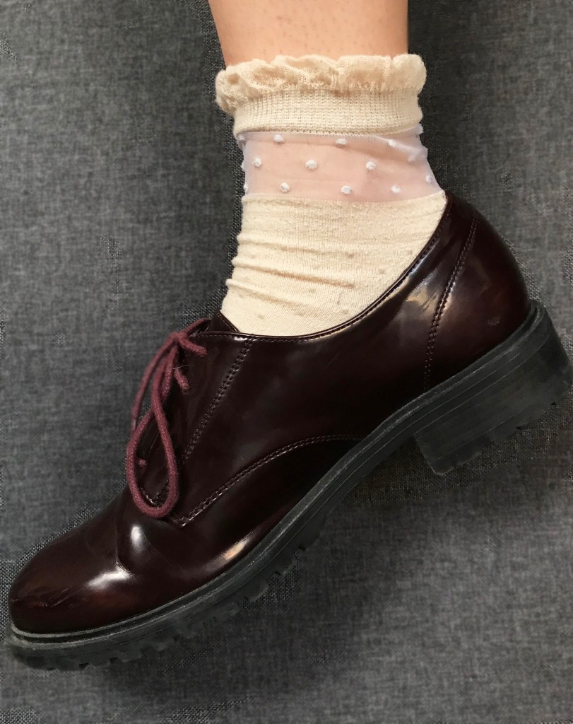 cream sock with polka dot ms detail on top, paired with burgundy shoe
