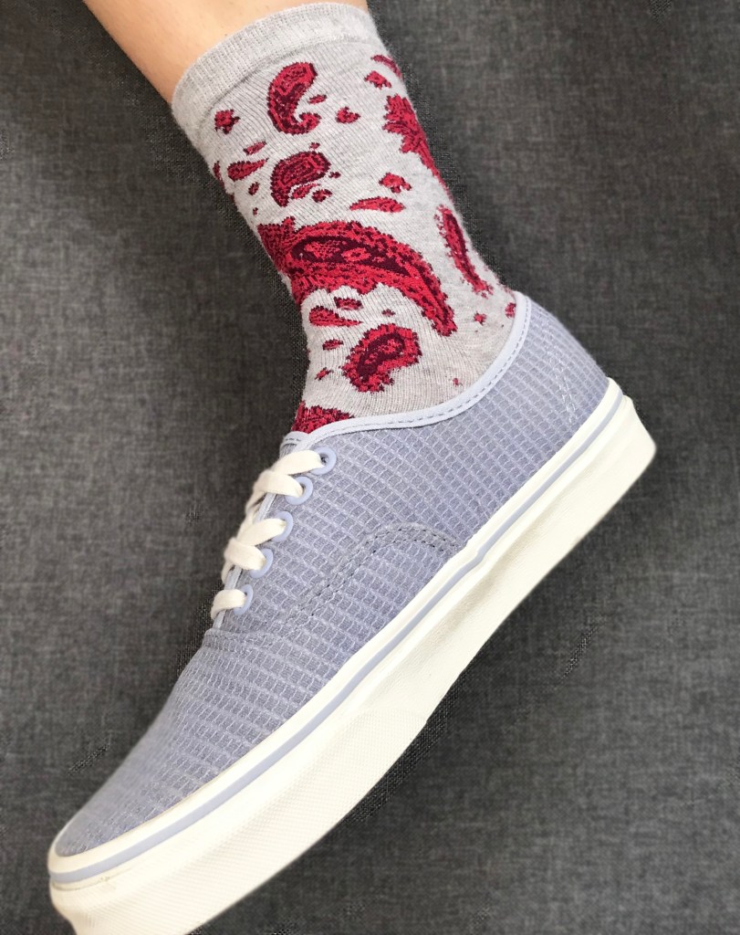 pattern sock pink, red design and grey, paired with blue van shoe.
